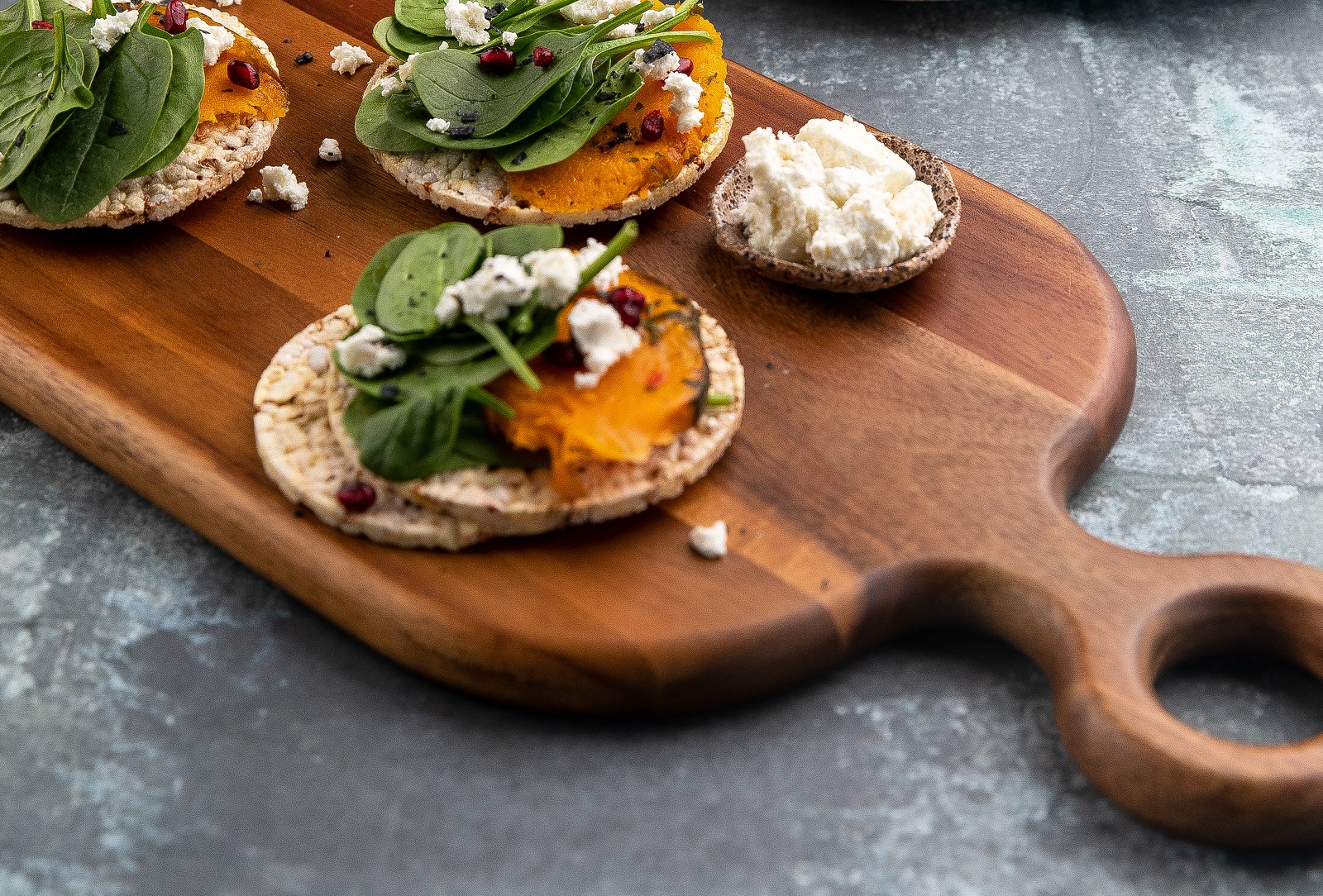 Roast Pumpkin, Baby Spinach, Goat's Cheese & Pomegranate on Corn Thins slices