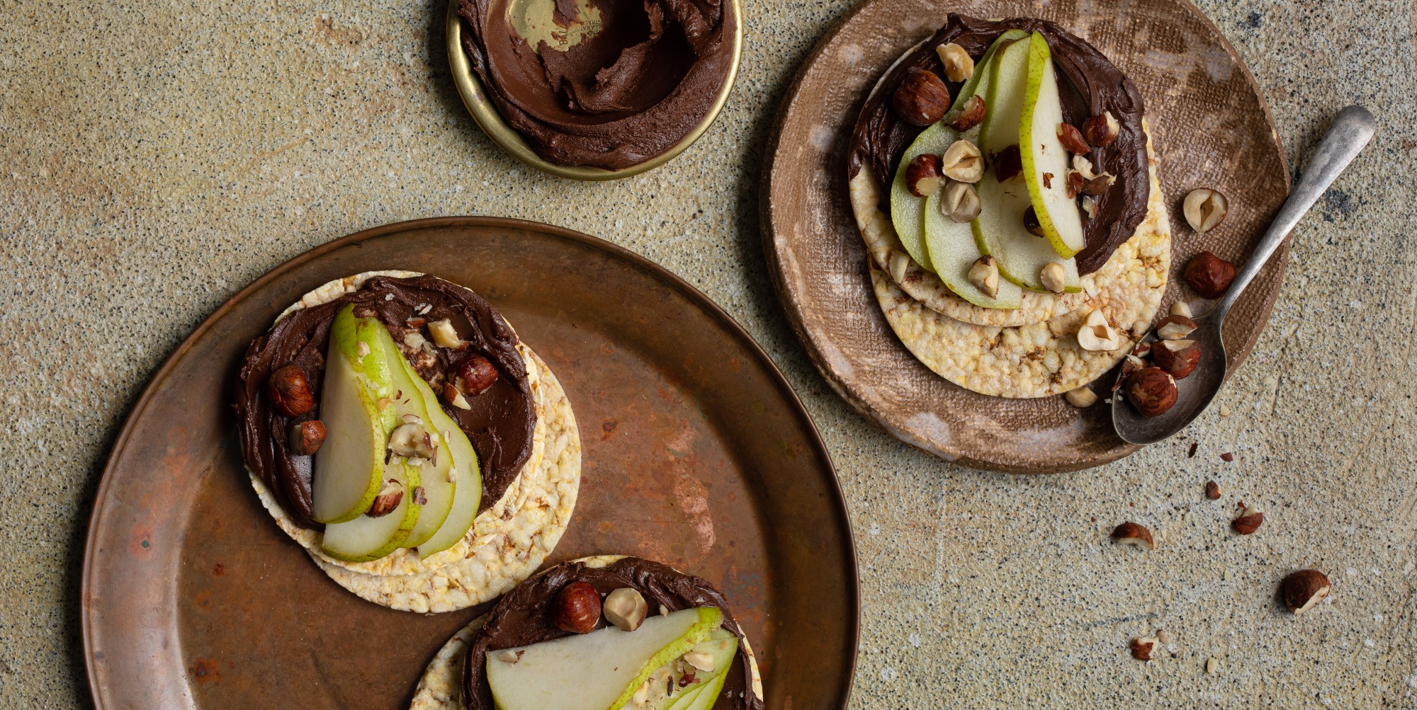 Choc hazelnut spread, pear & hazelnuts on Corn Thins slices