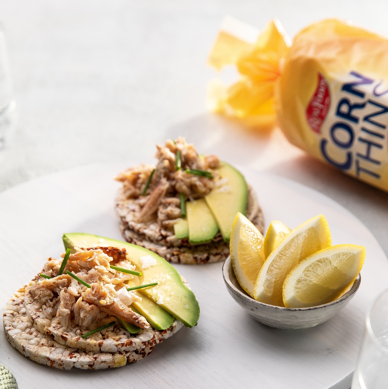 Crab meat, avocardo, lemon & chives on Corn Thins slices